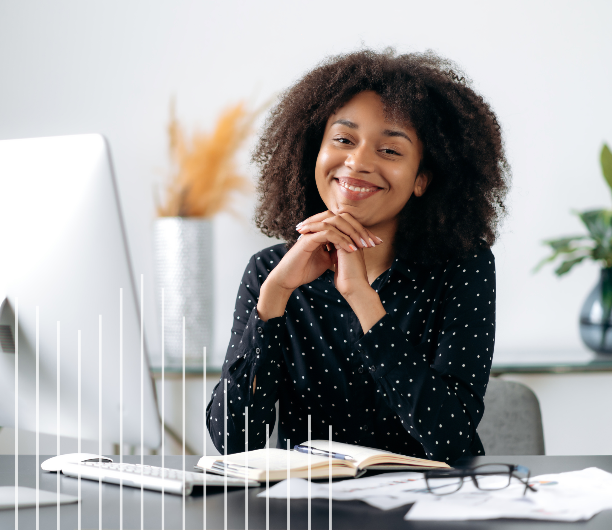Woman sitting at desk smiling
